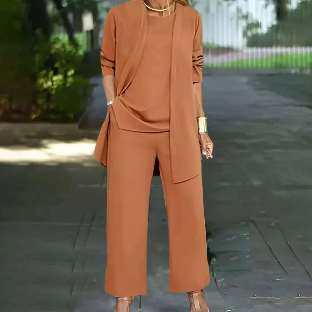 Professional women's three-piece suit: a chic blazer, vest, and trousers for office wear and formal occasions.