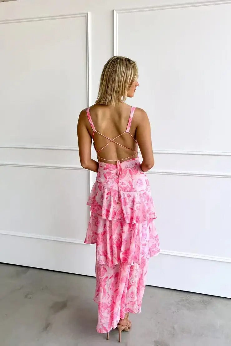 Stylish women's tiered maxi dress, featuring vibrant floral patterns for spring