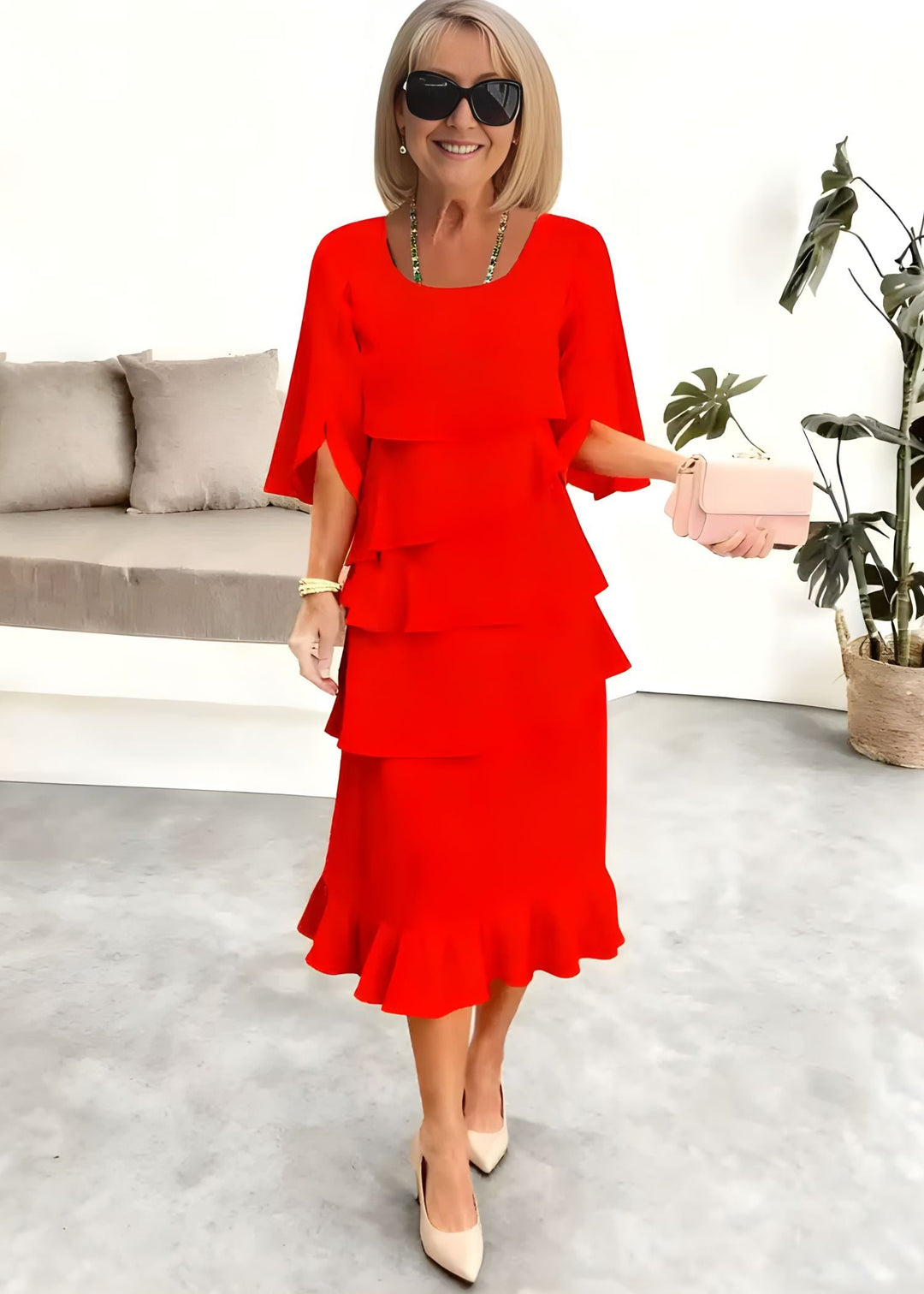 Chic women's tiered midi dress featuring flowing ruffles & stylish flared sleeves. Round neck party dress.