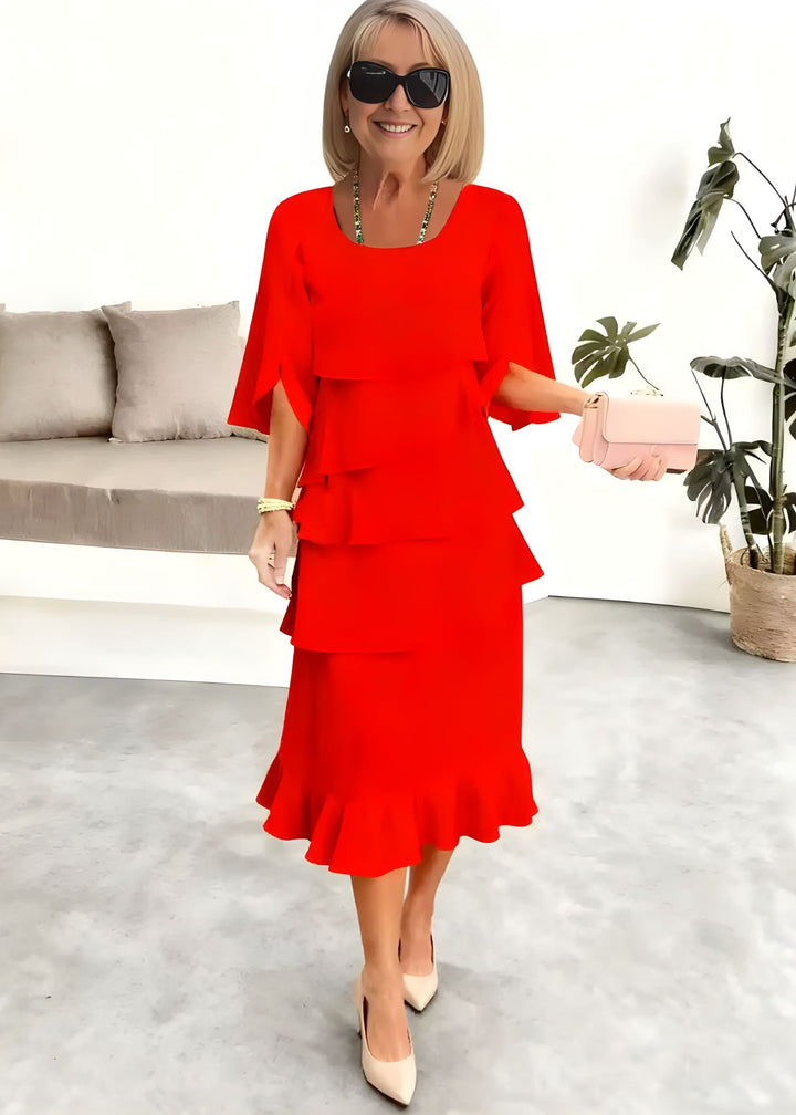 Chic women's tiered midi dress featuring flowing ruffles & stylish flared sleeves. Round neck party dress.