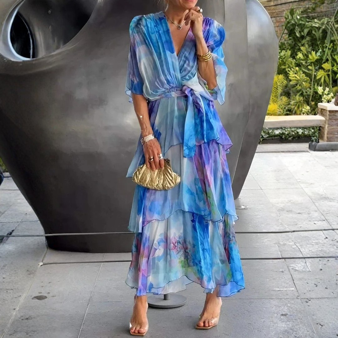 Sophisticated printed wrap dress with tiered skirt for women. Ideal for summer evenings & formal events.