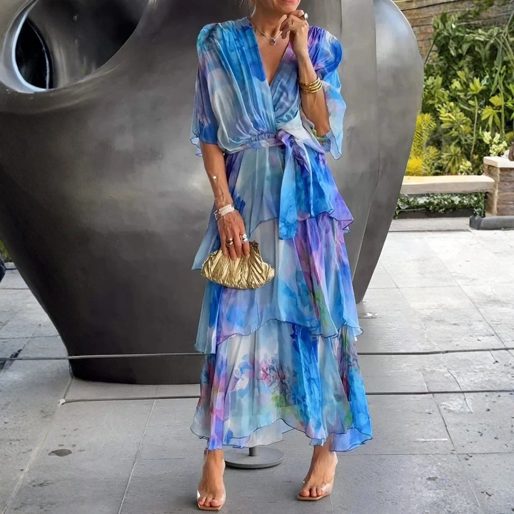 Sophisticated printed wrap dress with tiered skirt for women. Ideal for summer evenings & formal events.