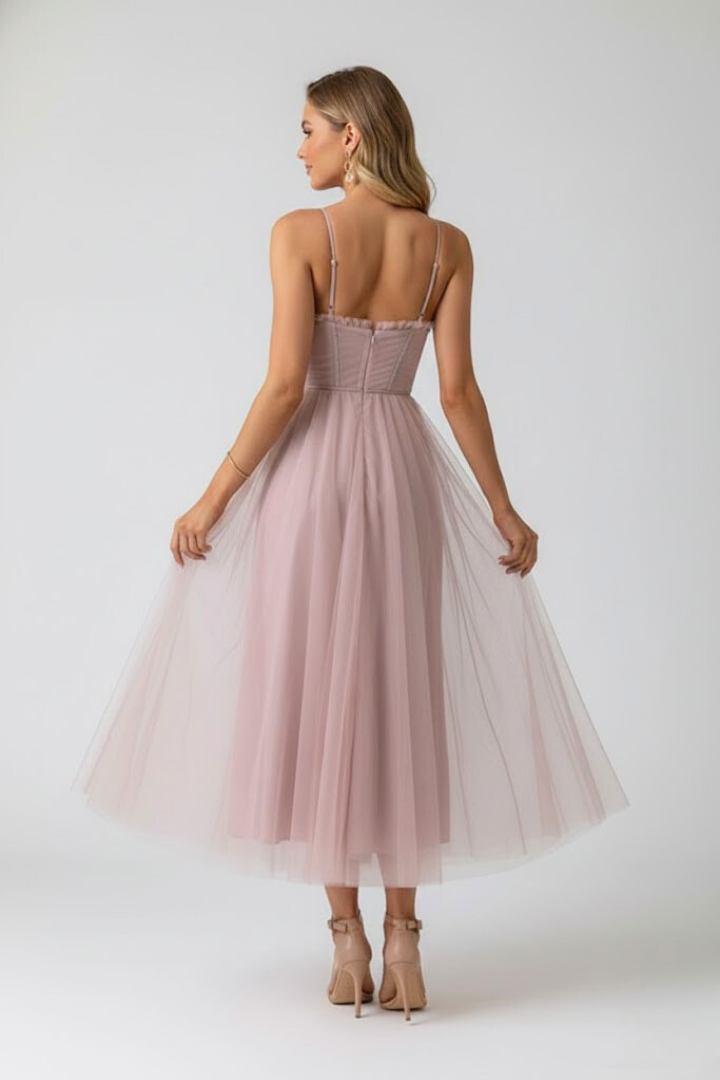 Elegant women's midi tulle dress with sweetheart neckline & thin spaghetti straps. Ideal for evening wear.