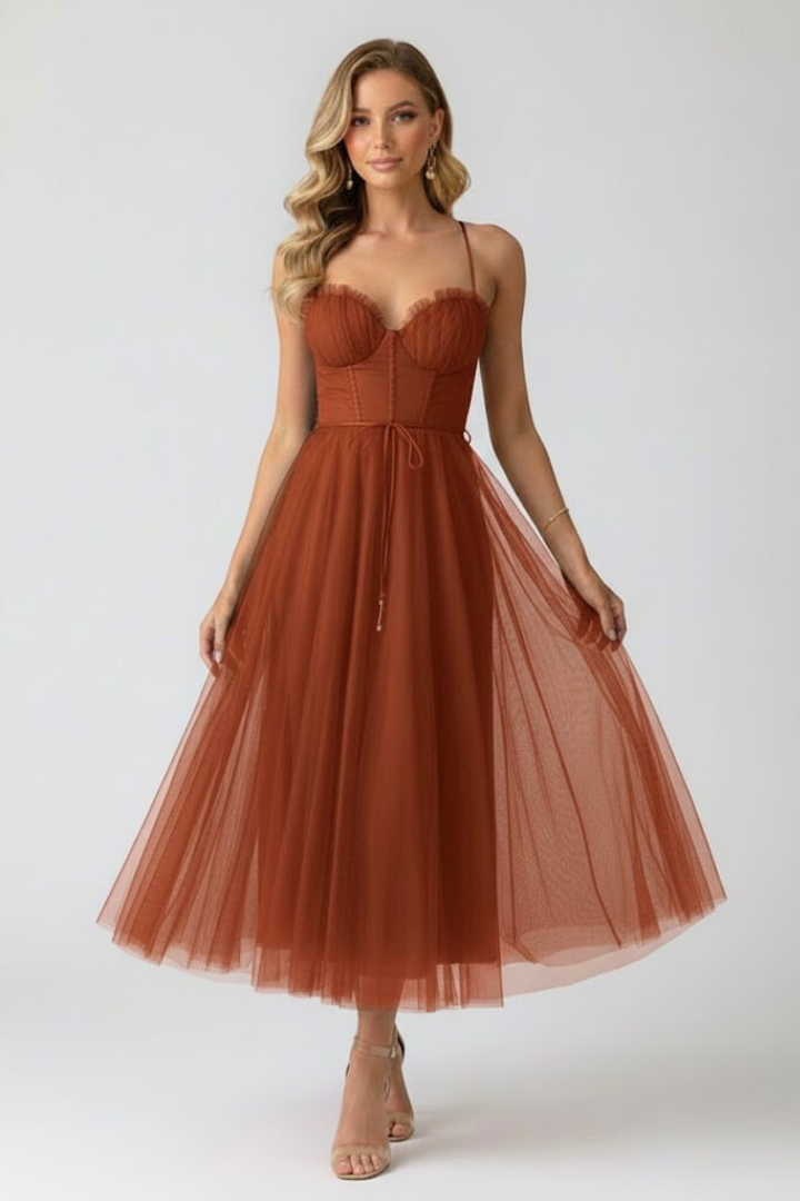 Sophisticated women's elegant tulle dress, midi length, sweetheart neckline, layered skirt. Party-ready.