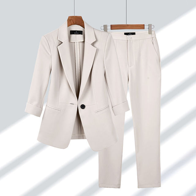 Professional women's blazer and pants set. Chic two-piece outfit for office, business meetings, and formal events.