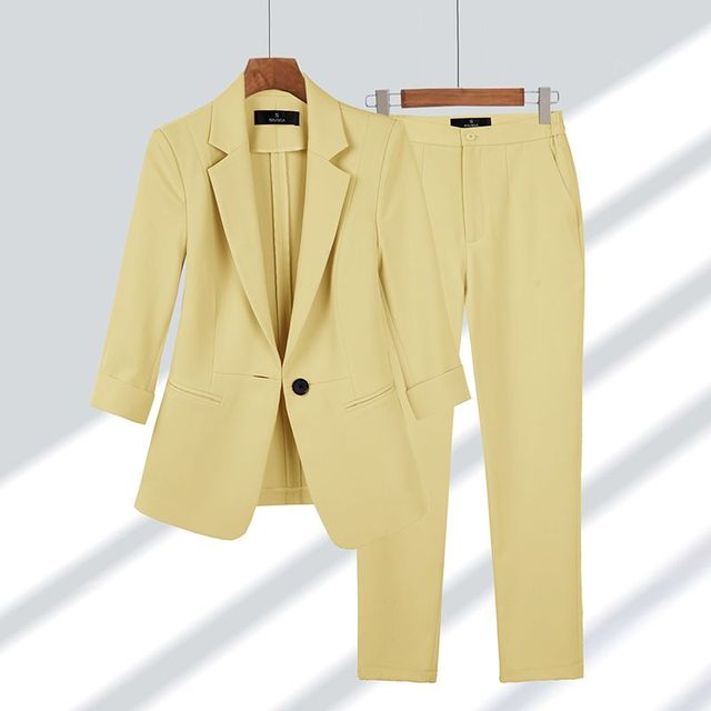 Chic women's elegant blazer and pants set. Versatile professional wear for office or stylish formal events.