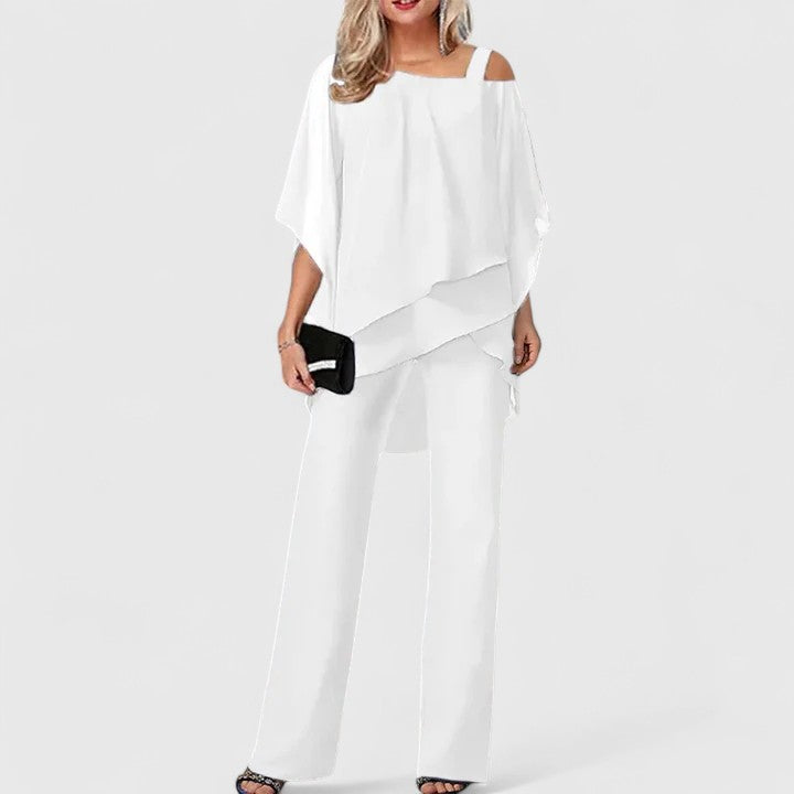 Chic women's pant set featuring a stylish top and flowing trousers. Elegant two-piece outfit for fashion-forward women.
