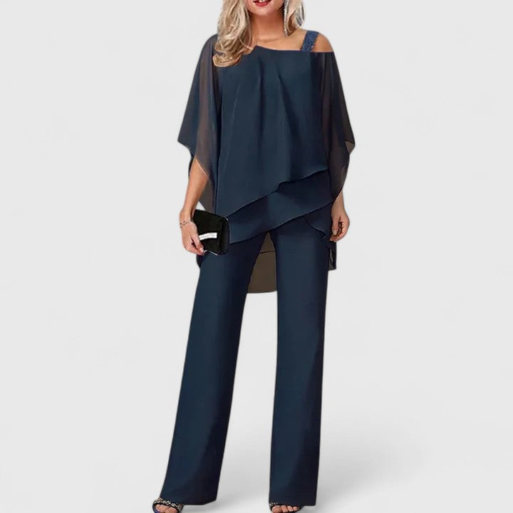 Stylish woman wearing an elegant two-piece pant set, showcasing versatile fashion for work or casual events.