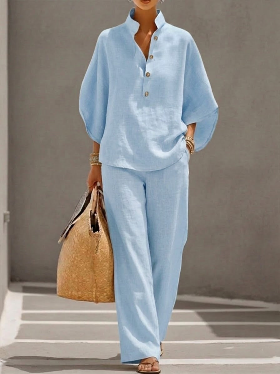 Stylish women's coordinating set featuring a chic batwing top and comfortable wide-leg fashion trousers.