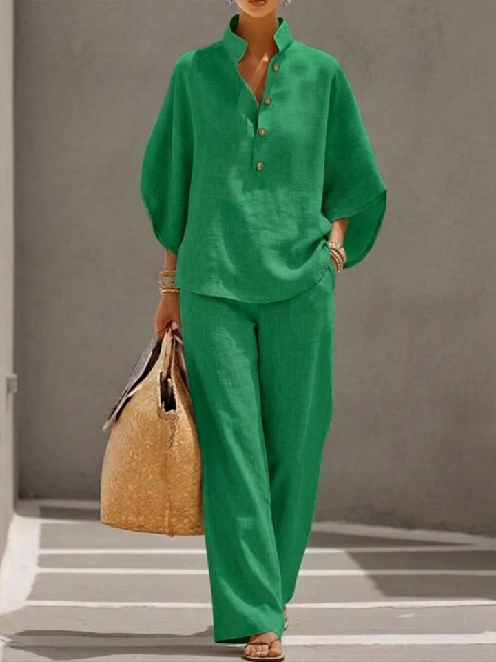 Comfortable women's loungewear set with a relaxed batwing blouse and wide-leg trousers for ultimate ease.