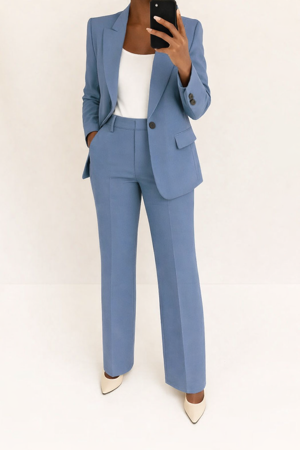 Elegant women's two-piece set featuring a tailored blazer and chic wide-leg pants. Perfect for formal and business attire.