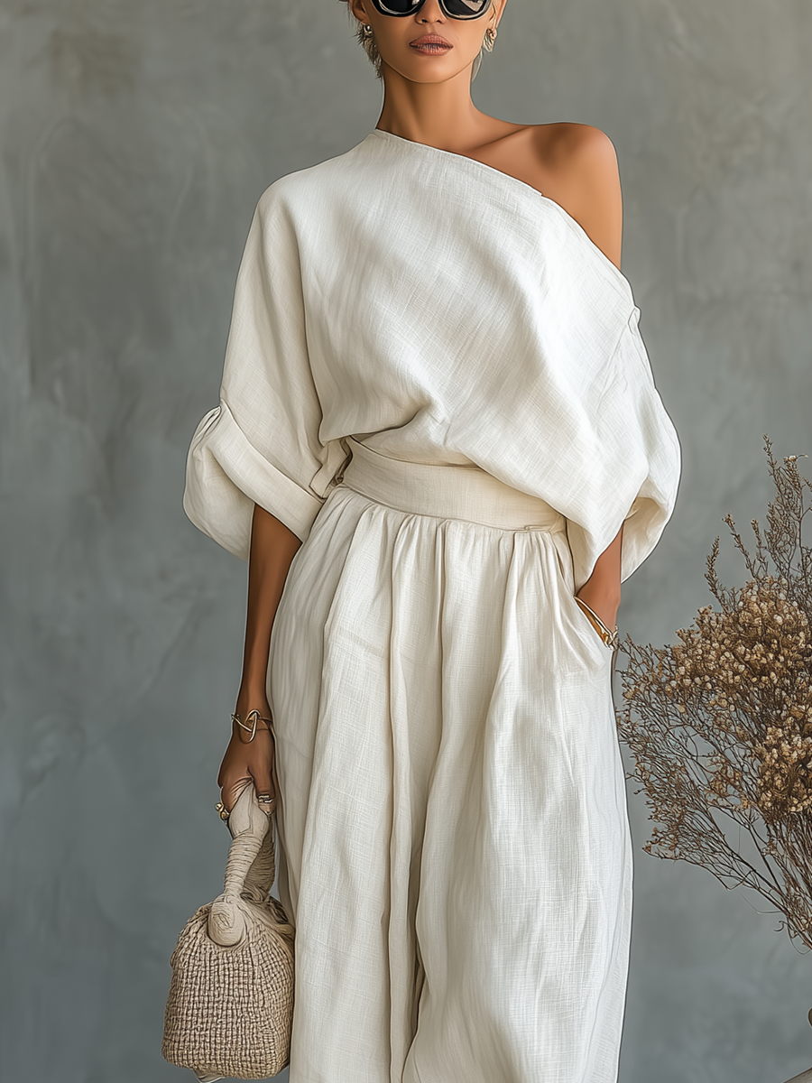 Coordinated women's summer outfit: asymmetric drape top and elastic waist wide leg pants for a chic look.