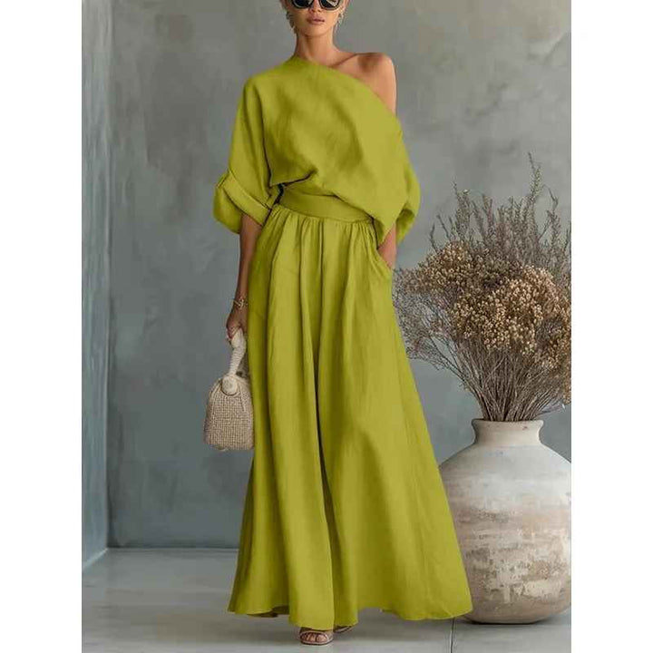 Versatile women's summer outfit: an asymmetric drape top and elastic waist wide-leg pants, perfect for day or night.