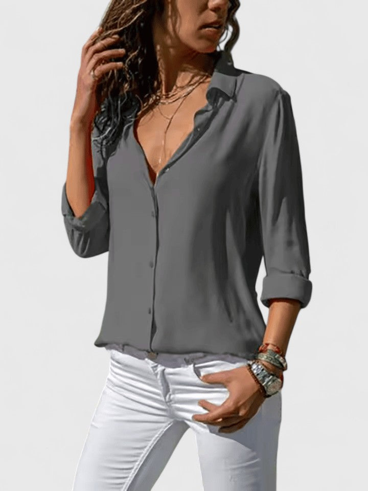 Stylish V-neck women's blouse; a comfortable, relaxed fit top suitable for both casual everyday wear and work apparel.