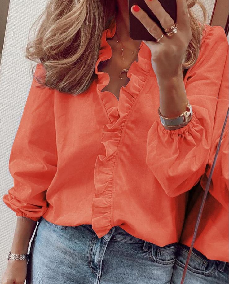 Elegant women's ruffle V-neck blouse. A stylish, versatile top suitable for workwear, casual or fashion outfits.