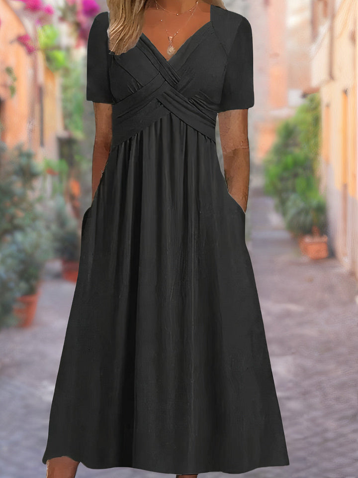 Full view of a stylish women's V-neck crisscross bodice midi dress, ideal for casual or evening wear.