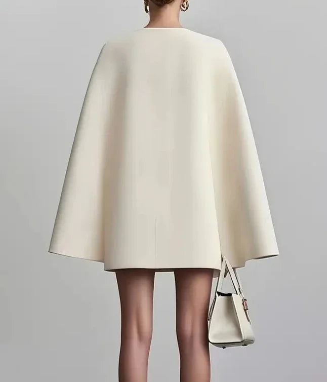 Chic women's blazer mini dress with a deep V-neck and classic double-breasted design, ideal for cocktail wear.