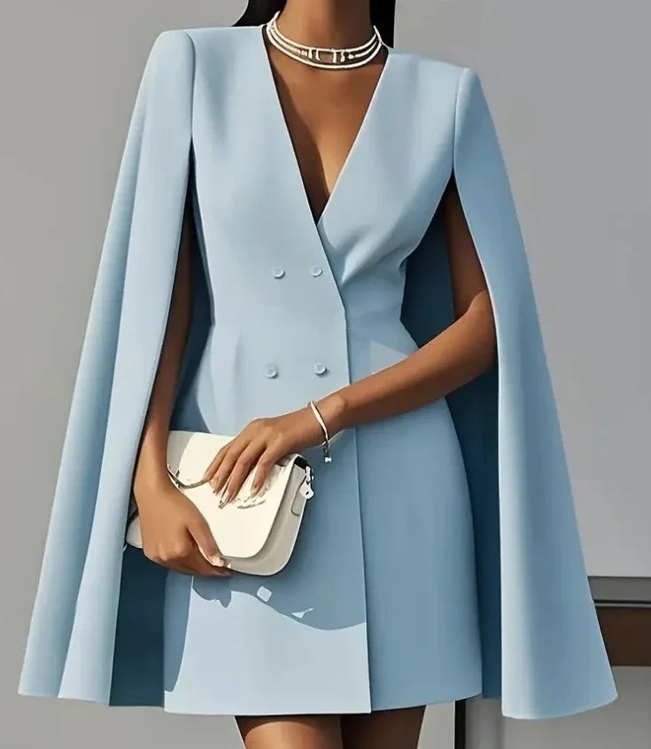 Fashionable V-neck double-breasted mini blazer dress on a model, showcasing a modern women's evening look.