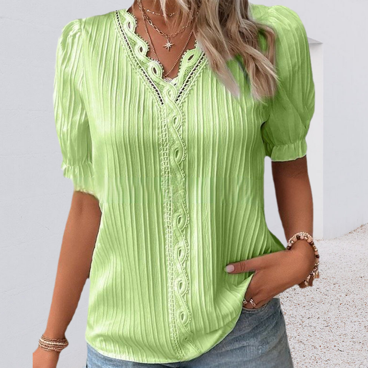 Folded V-neck lace trim blouse, neatly presented, ready for packaging, women's fashion