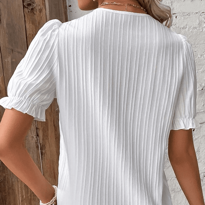 White women's V-neck lace trim blouse, a versatile top for elegant summer casual fashion