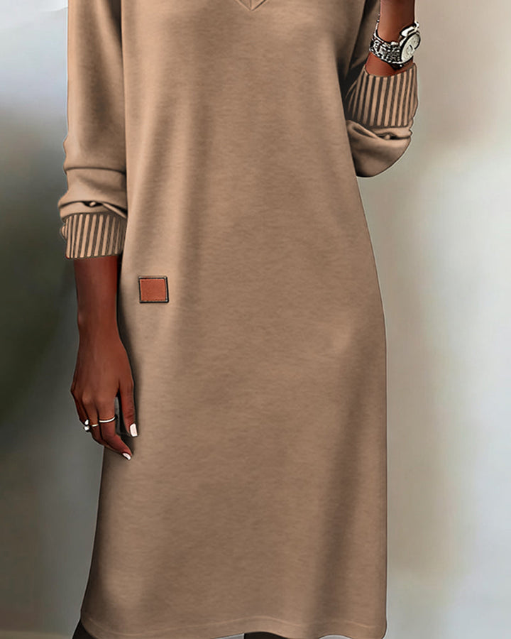 Full-length view of an elegant women's V-neck long sleeve midi dress, ideal for sophisticated office workwear.