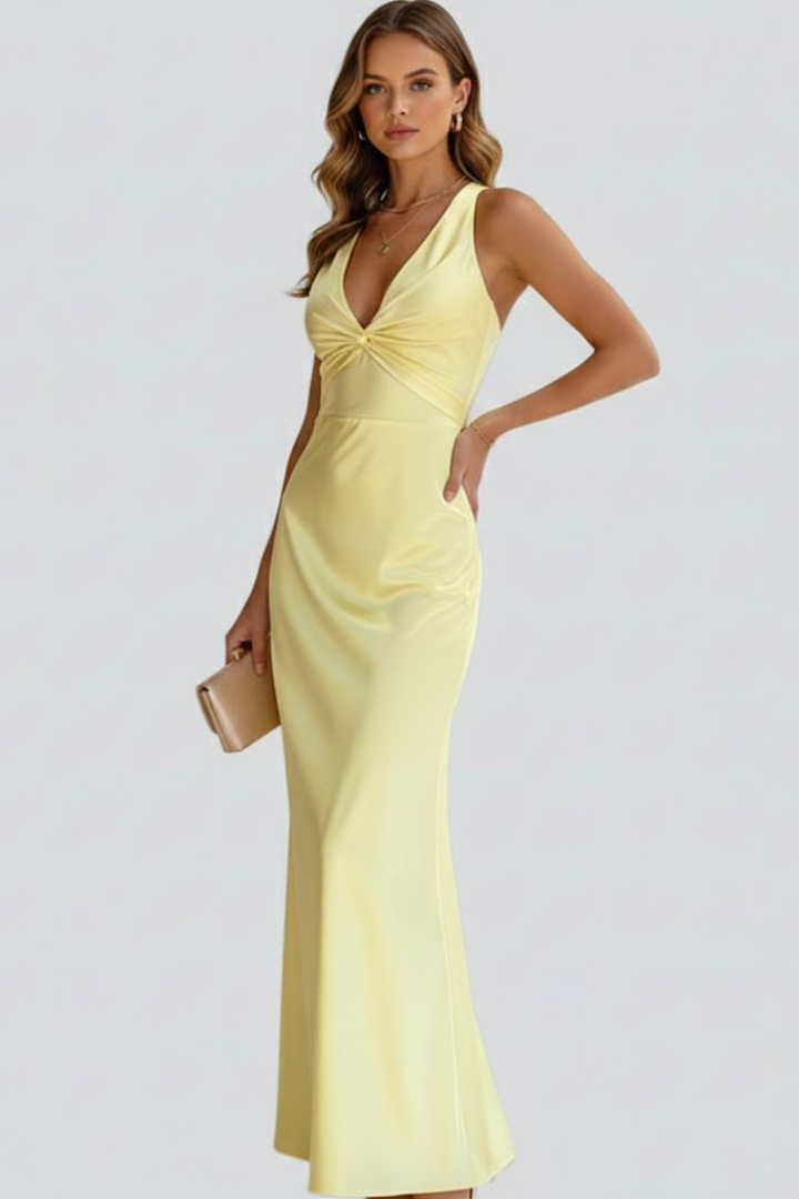 Close-up of a women's V-neck maxi dress, highlighting the elegant neckline and fitted waist detail.