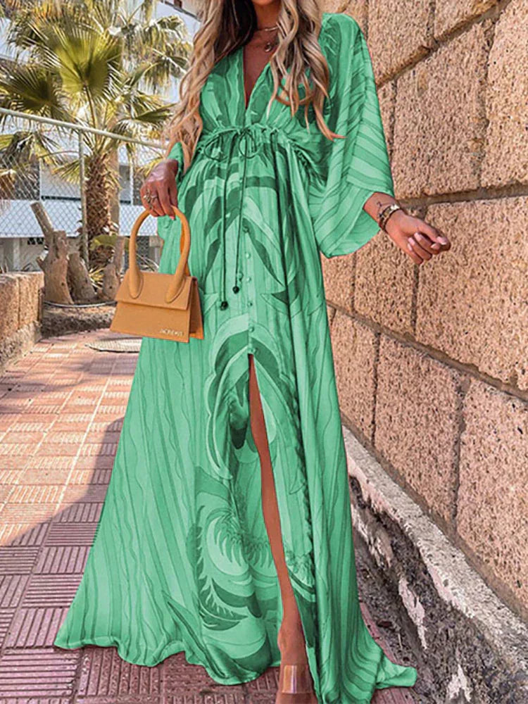 Stunning women's V-neck maxi dress with elegant kimono sleeves & a chic high slit, suitable for evening wear.