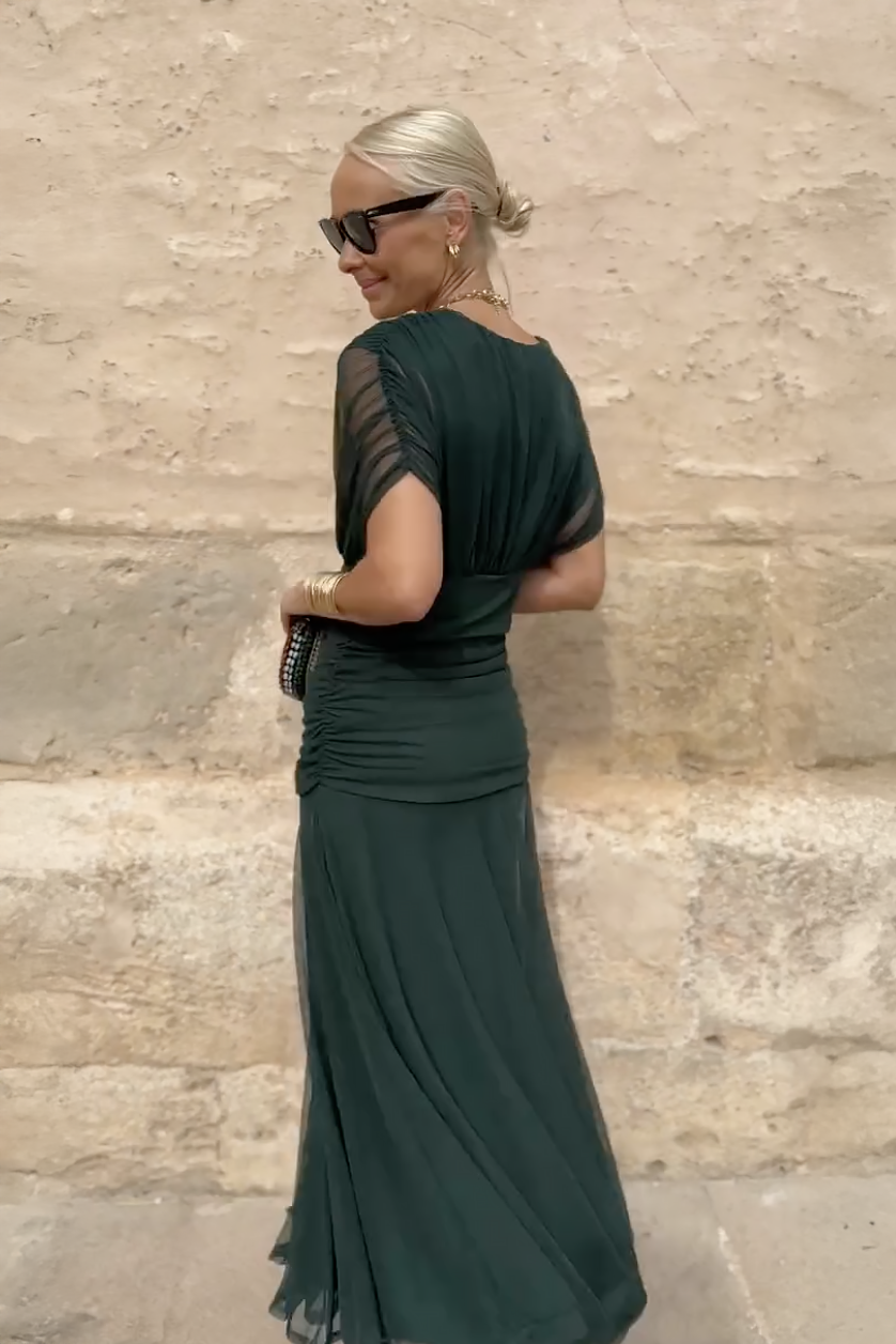 Women's elegant V-neck maxi dress with ruched waist, formal wedding guest attire.