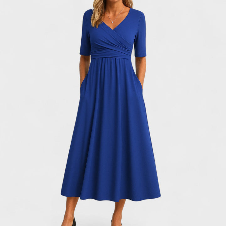 Fashionable women's midi dress with V-neck, suitable for parties. Elegant and comfortable.