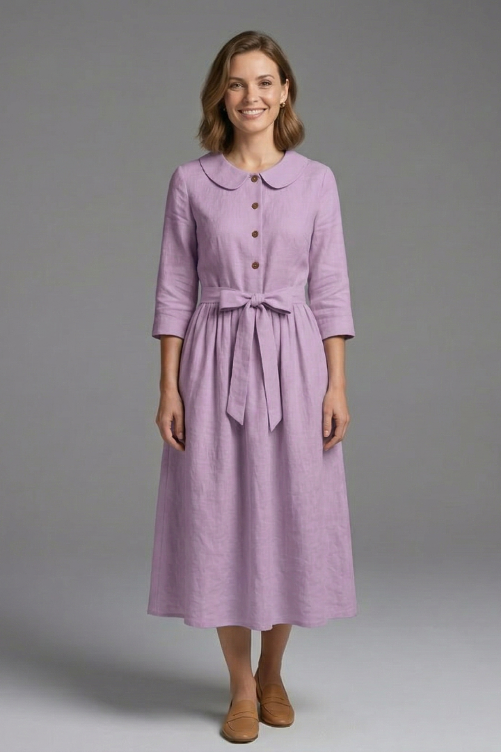 Elegant sleeveless women's midi dress with a deep V-neck and a stylish waist tie for a sleek look.