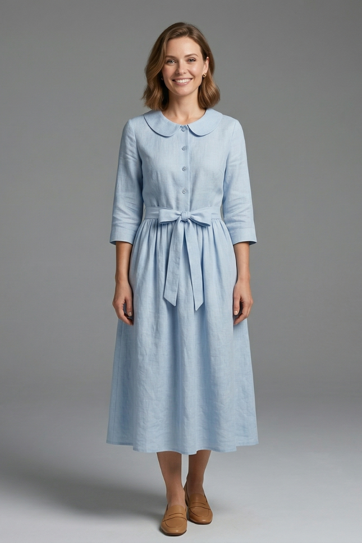 Flowy sleeveless V-neck midi dress for women, featuring a chic waist tie; ideal for casual or formal wear.