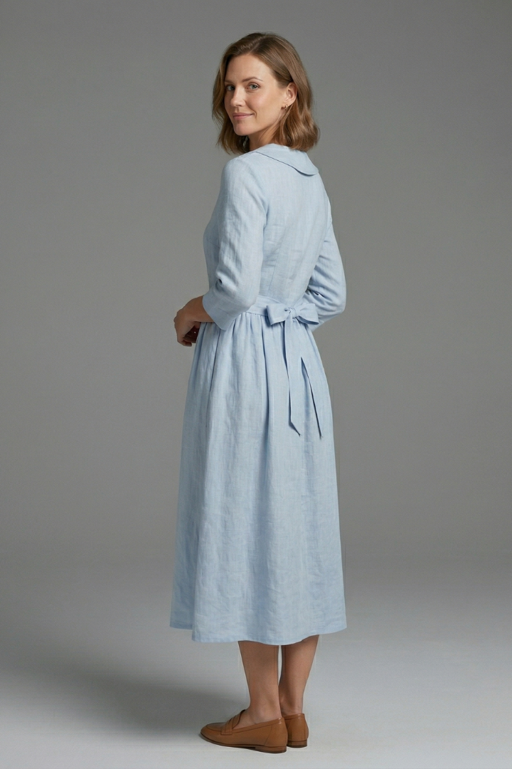 Stylish women's V-neck summer dress, midi length with a self-tie waist for an elegant silhouette.