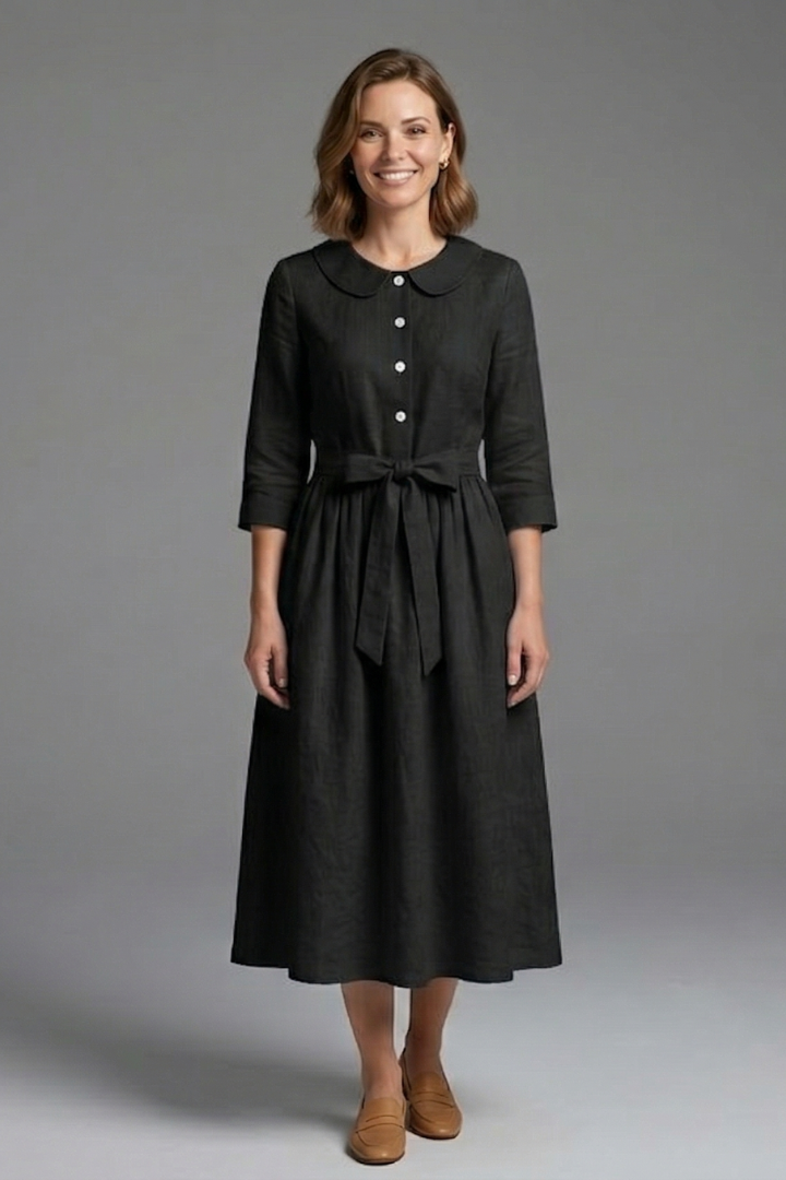Casual yet elegant women's midi dress, V-neck, sleeveless, and a comfortable waist tie, perfect for day wear.