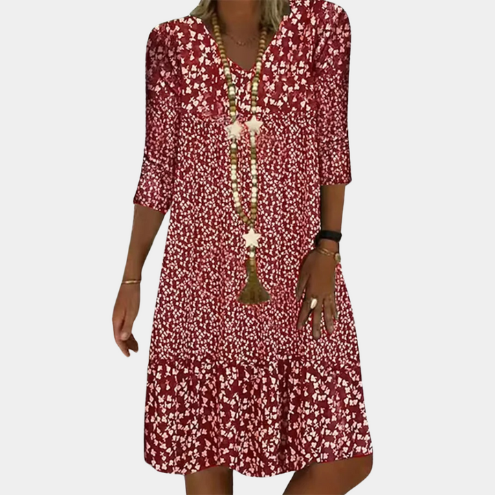 Chic women's V-neck midi summer dress with short sleeves. An elegant and comfortable choice for versatile everyday fashion.