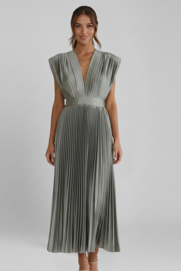 Beautifully structured pleats on a women's sleeveless midi dress, enhancing its elegant and flowing silhouette.