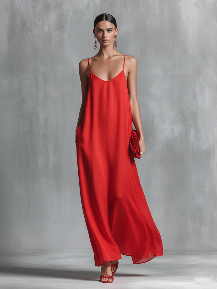 Red women's V-neck maxi dress with adjustable spaghetti straps and pockets. Comfortable, floor-length summer style.