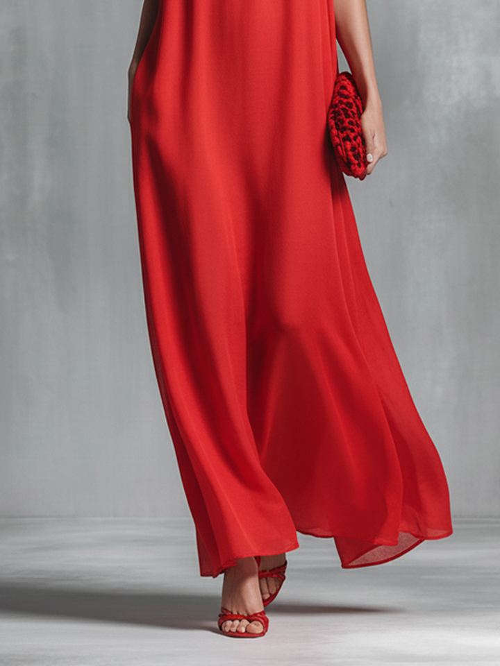 Women's V-neck A-line maxi dress featuring spaghetti straps, a comfortable fit, and practical pockets. Ideal summer wear.