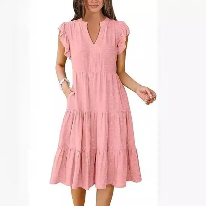 Flowy women's summer midi dress, V-neck, tiered design & flutter sleeves. Perfect for casual or party.