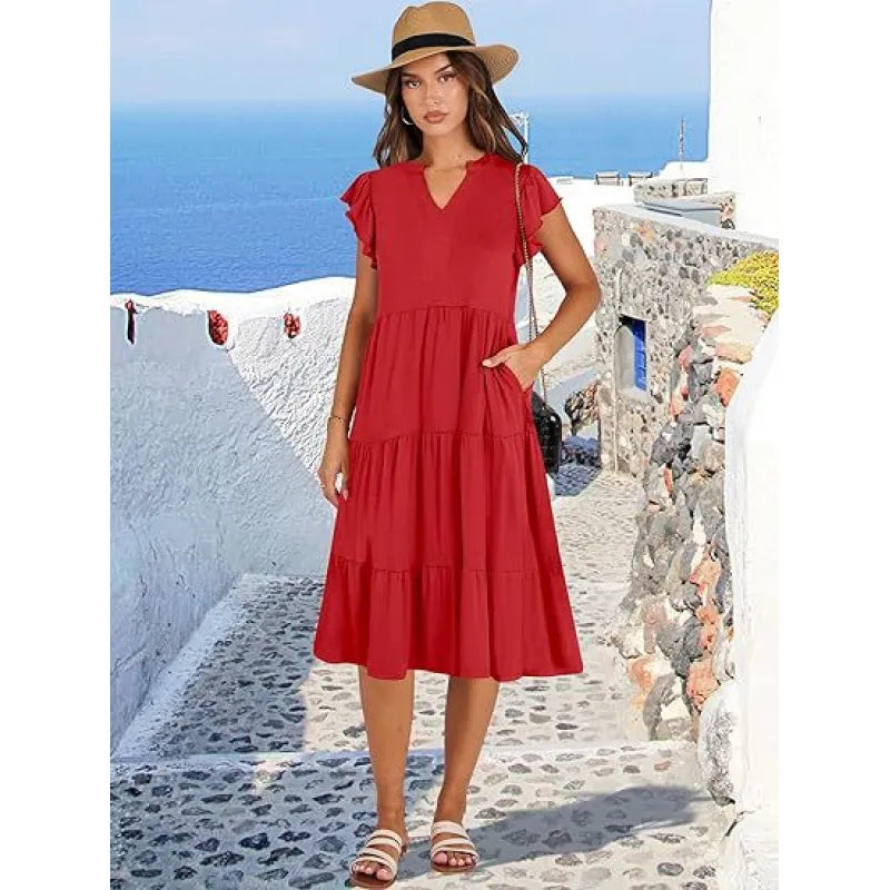 Elegant women's swing midi dress with V-neck, tiered skirt & flutter sleeves. Flowy & versatile for summer.
