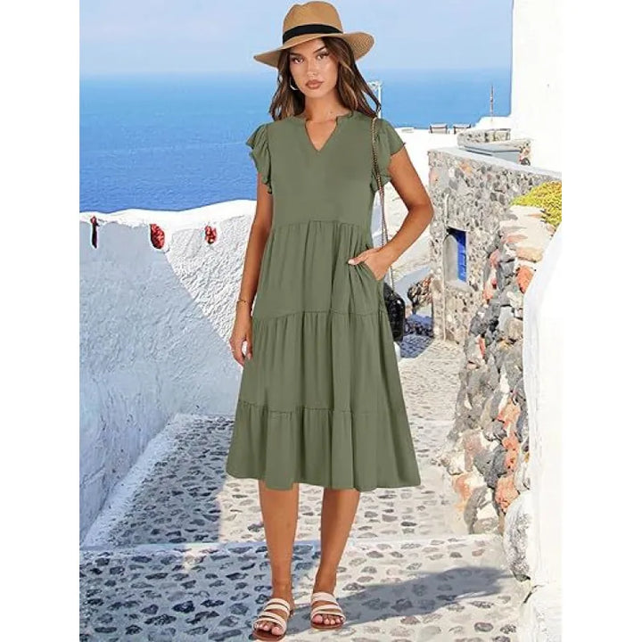Women's V-neck midi dress featuring tiered skirt & feminine flutter sleeves. Elegant, comfortable & versatile.