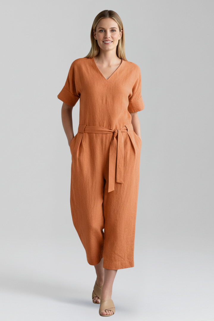 Chic long-sleeve V-neck jumpsuit for women, featuring a wide leg and elegant waist tie design.