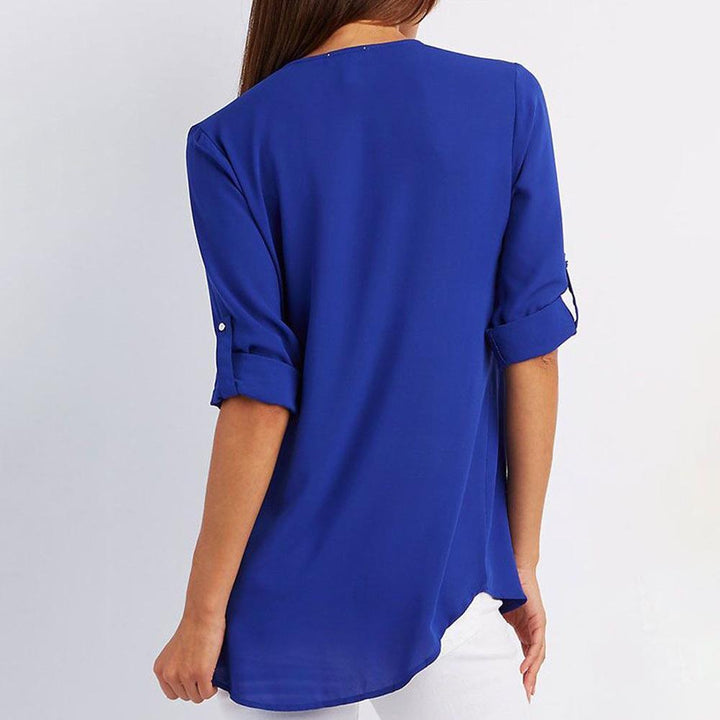 Front view of a women's V-neck zipper patchwork blouse, ideal for a stylish casual look