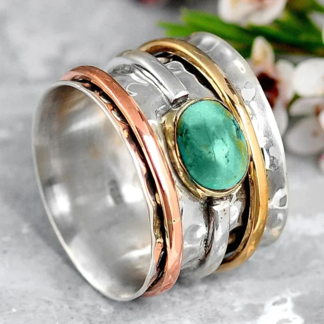 Elegant women's vintage turquoise ring with gold and silver accents, a stylish fashion accessory statement jewelry piece.
