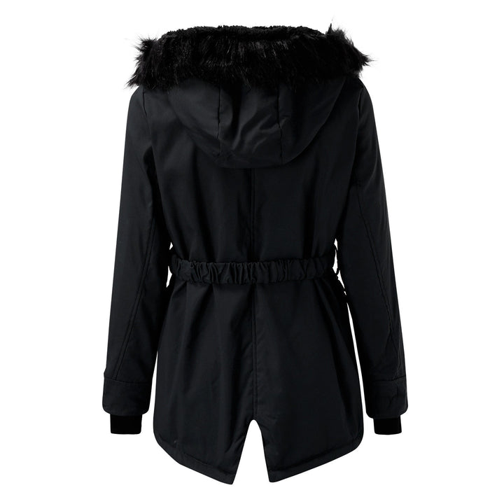 Folded warm women's winter coat with faux fur hood, ready for cold outdoor adventures.