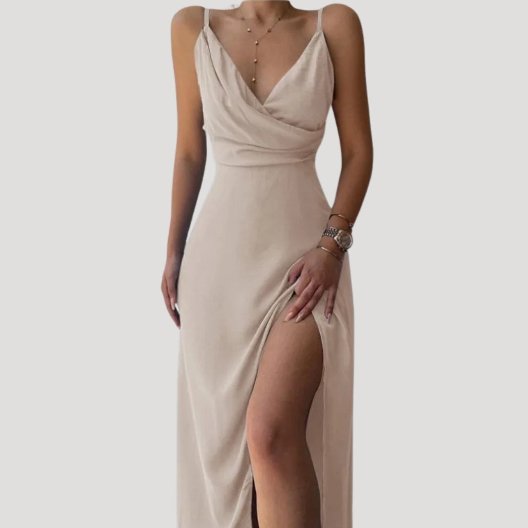Sophisticated red maxi dress, ideal for wedding guests, featuring a stylish high slit for an elegant look.