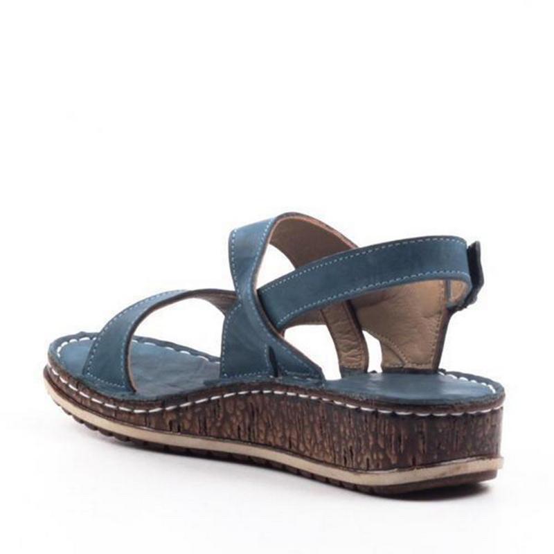 Sophisticated women's wedge sandals, bringing elegant summer style & comfort. Open-toe fashion footwear.