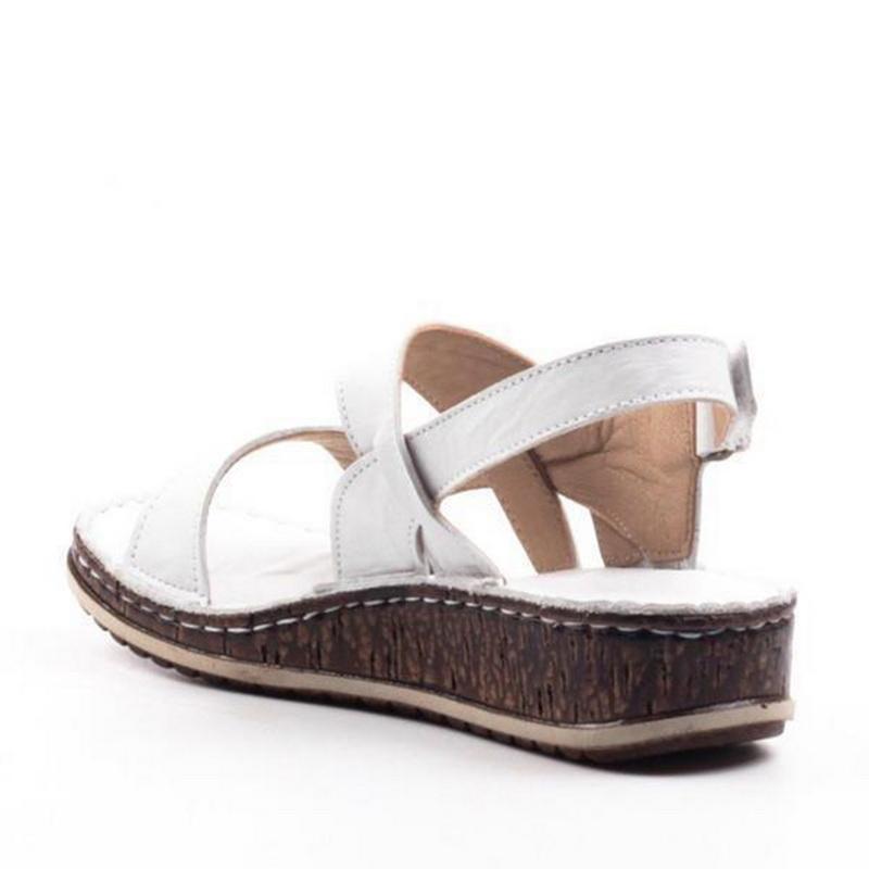 Fashionable women's open-toe wedge sandals. Elegant, comfortable footwear for any summer occasion.