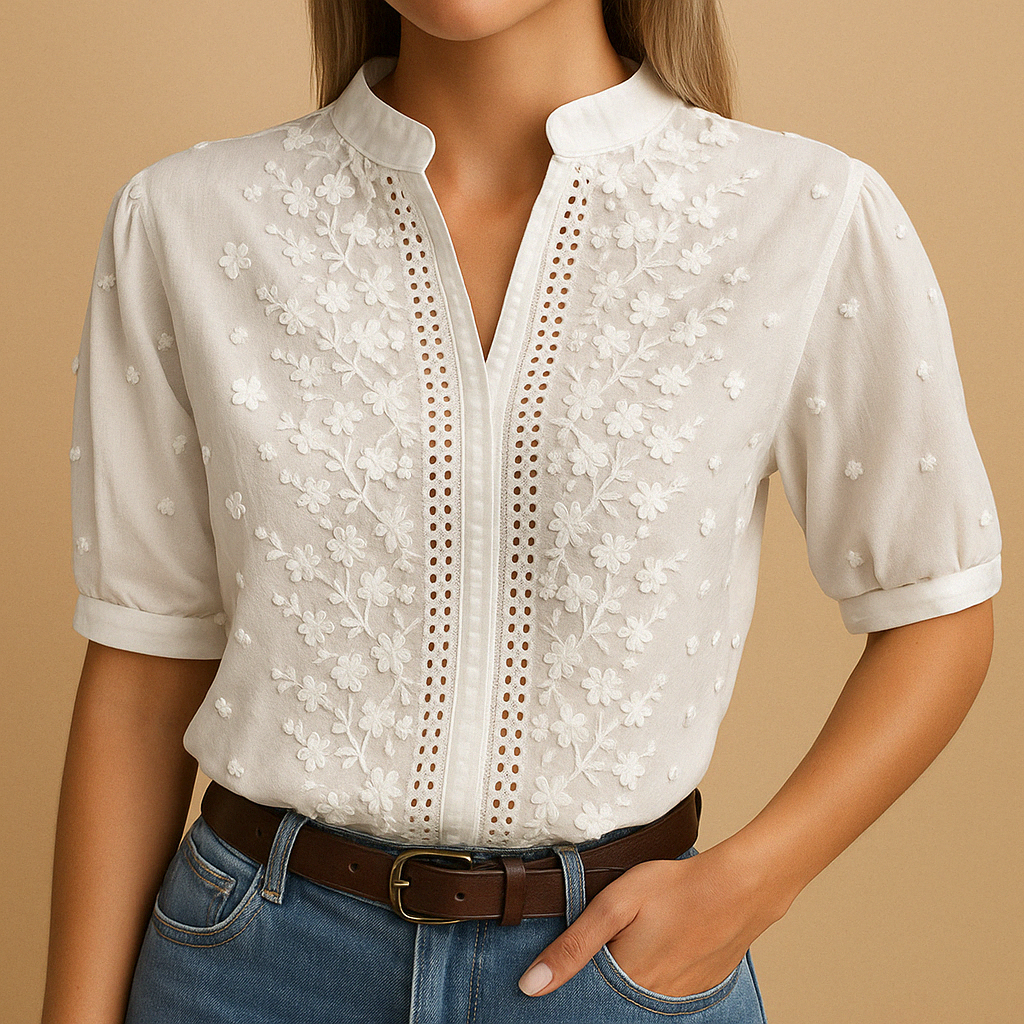 Versatile white button-up blouse for women, featuring a classic collar, ideal for casual or professional outfits.
