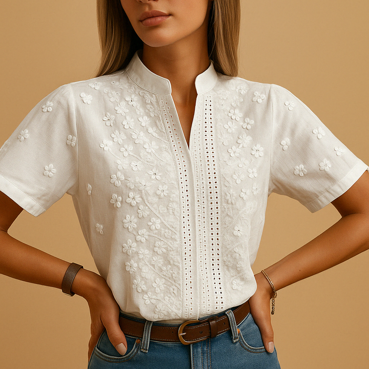 Timeless white women's blouse with classic collar, comfortable and stylish for office wear or elegant casual fashion.