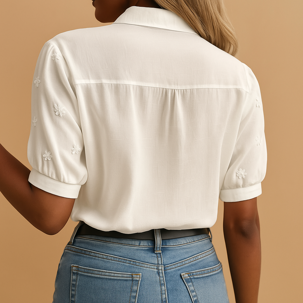 Professional women's white blouse with classic collar, a clean, elegant top suitable for office and business attire.